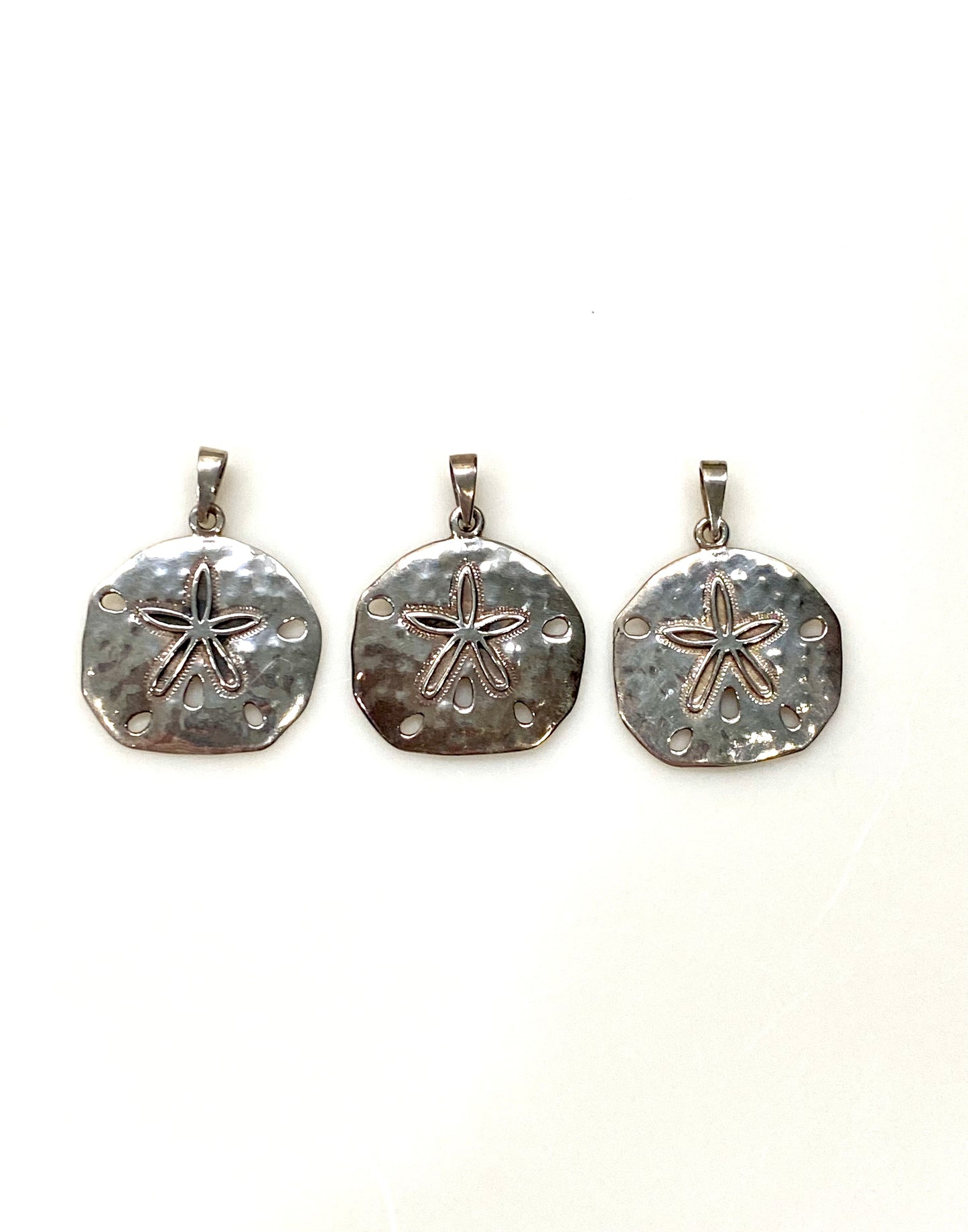 THREE STERLING SILVER SAND DOLLAR CHARM/PENDANTS